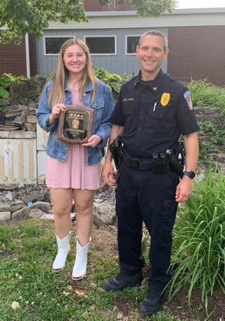 Police Chief Alan Hucke with scholarship winner Elizabeth Tribout 