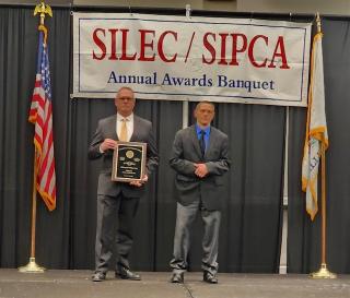 Retired Chief Wilkerson receives his award.